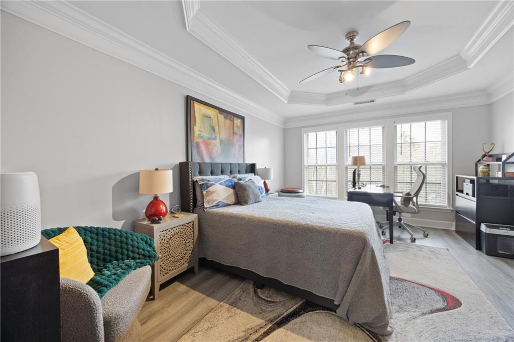 2871 Overlook Way Atlanta, GA 30324 - Photo 16 of 32 a bedroom with a bed and a chandelier