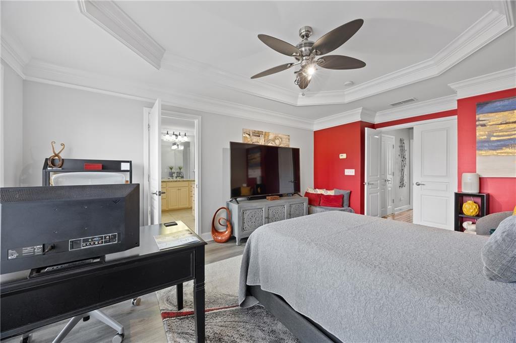 2871 Overlook Way Atlanta, GA 30324 - Photo 17 of 32 a bedroom with a bed and a flat screen tv