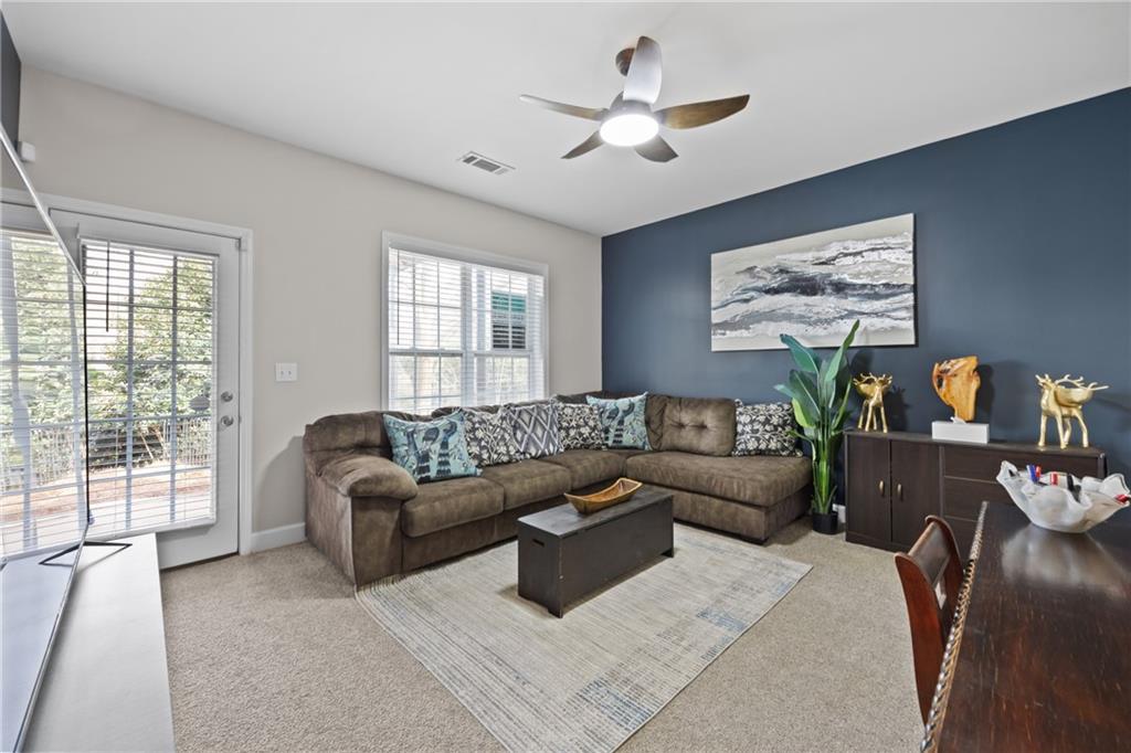 2871 Overlook Way Atlanta, GA 30324 - Photo 21 of 32 a living room with furniture and a flat screen tv