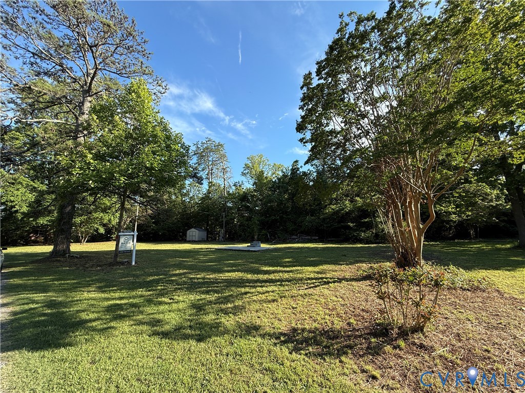 88 Seahawk Road Urbanna, VA 23175 - Photo 15 of 16 Expansive grassy yard featuring mature trees and a