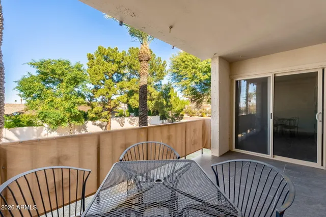a view of balcony with furniture