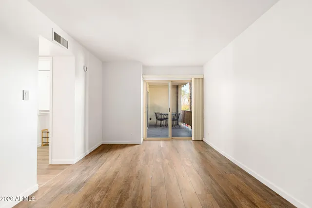 a view of hallway with wooden floor