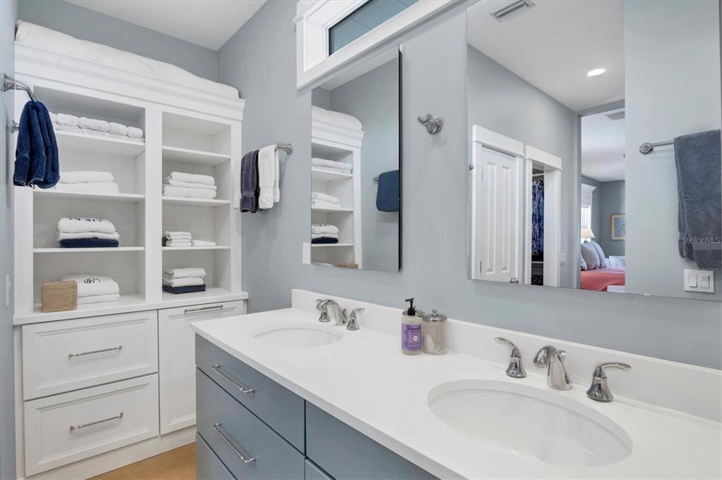 250 Wheeler Road Boca Grande, FL 33921 - Photo 14 of 34 a bathroom with a double vanity sink and mirror