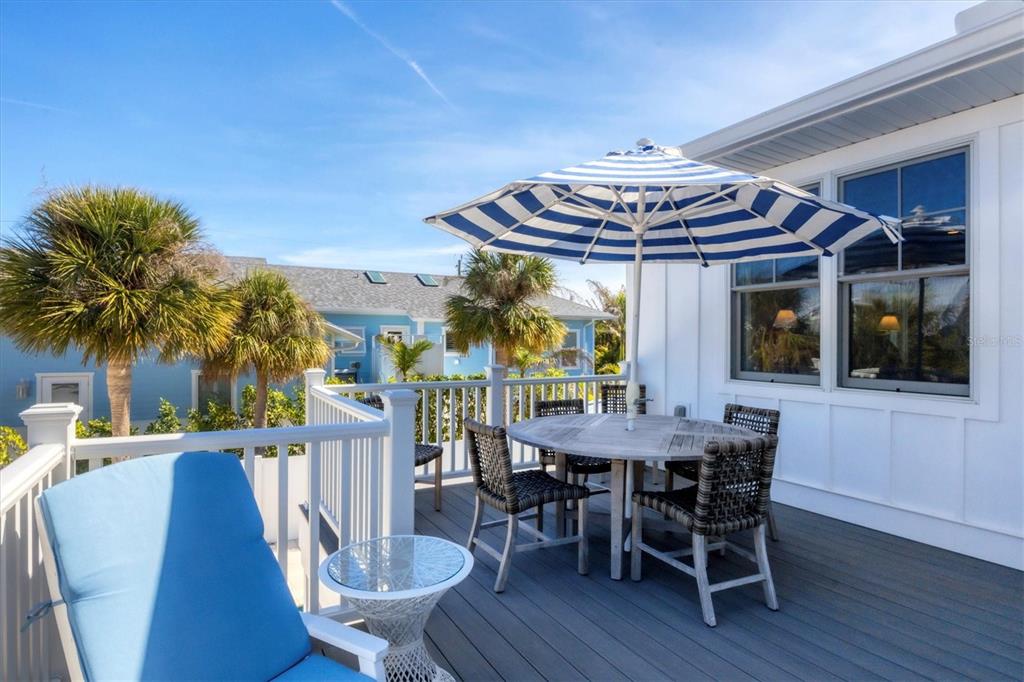 250 Wheeler Road Boca Grande, FL 33921 - Photo 26 of 34 a view of a dining room with furniture and wooden floor
