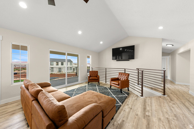 2591 East Washington Dam Road Washington, UT 84780 - Photo 8 of 67 Spacious open-concept room featuring vaulted ceilings, recessed lighting, and wood-finish flooring