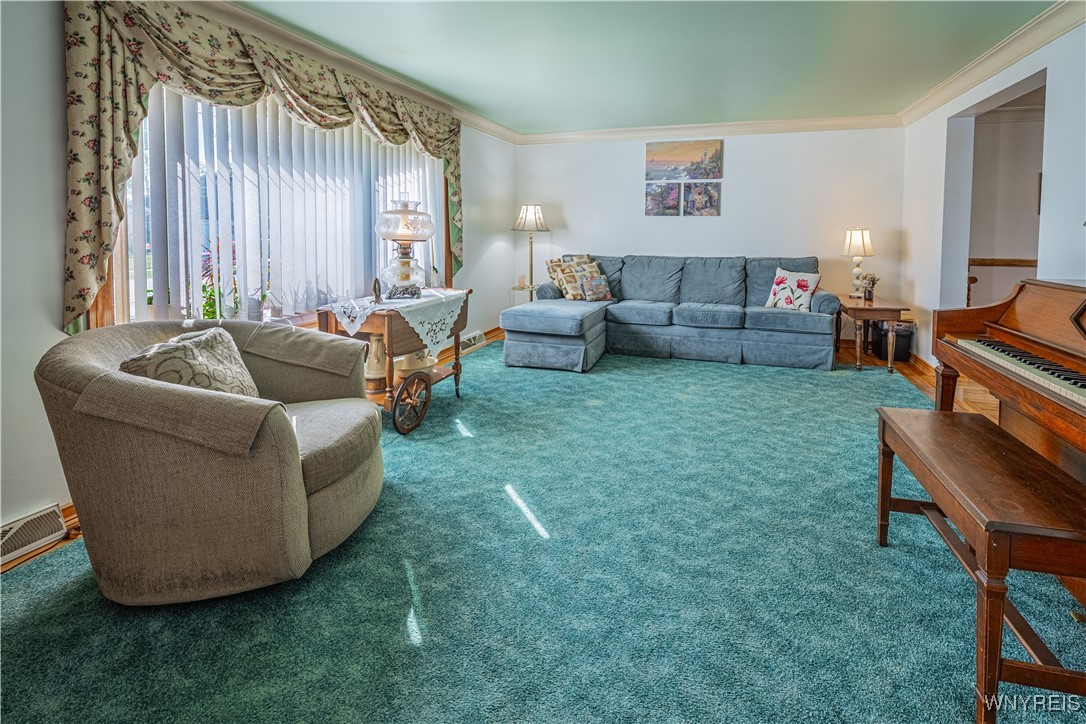 18 Louise Drive Cheektowaga, NY 14227 - Photo 6 of 41 Spacious living room with hardwoods floors under t