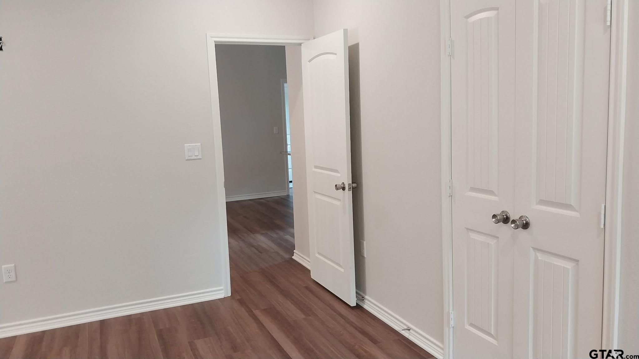 1262 George Richey Road Gladewater, TX 75647 - Photo 6 of 22 a view of a room with wooden floor