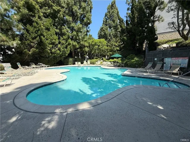 a view of a swimming pool with an outdoor space