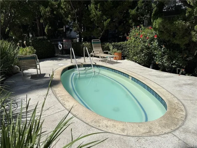 a view of a swimming pool with a yard