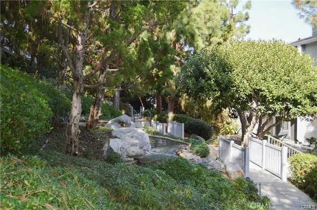 a view of a backyard with sitting area