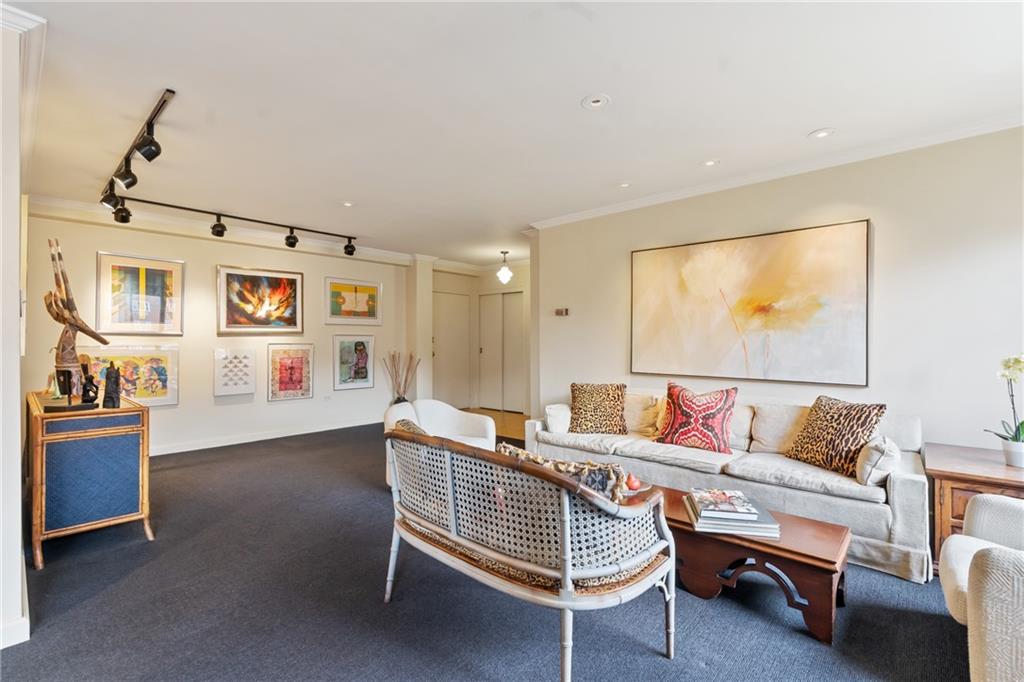 128 North Craig Street, Unit 612 Pittsburgh, PA 15213 - Photo 5 of 22 a living room with furniture and a flat screen tv