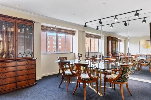 a view of a a dining room with furniture window and outside view