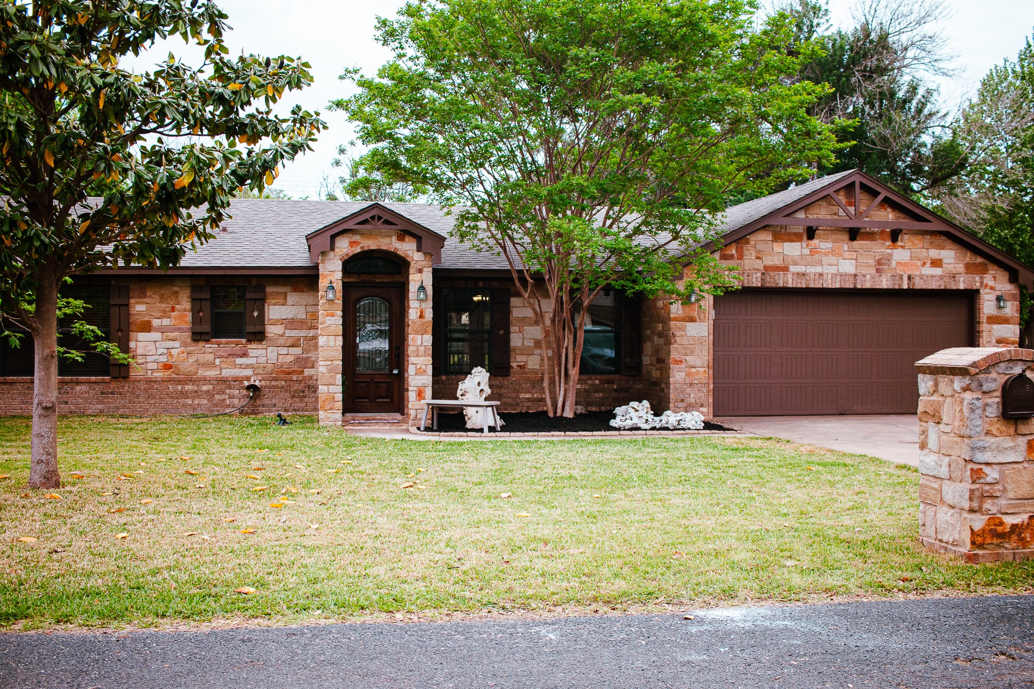 a view of a house with pool and a yard