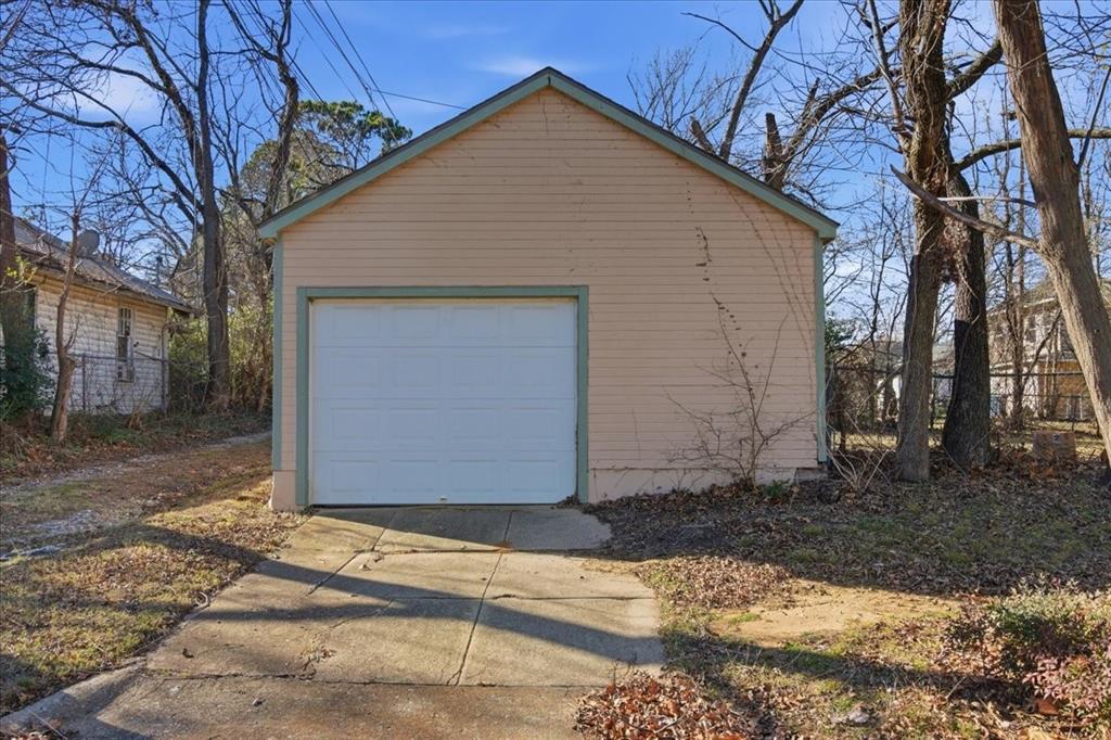 1000 West Morgan Street Denison, TX 75020 - Photo 23 of 30 Detached garage with concrete driveway