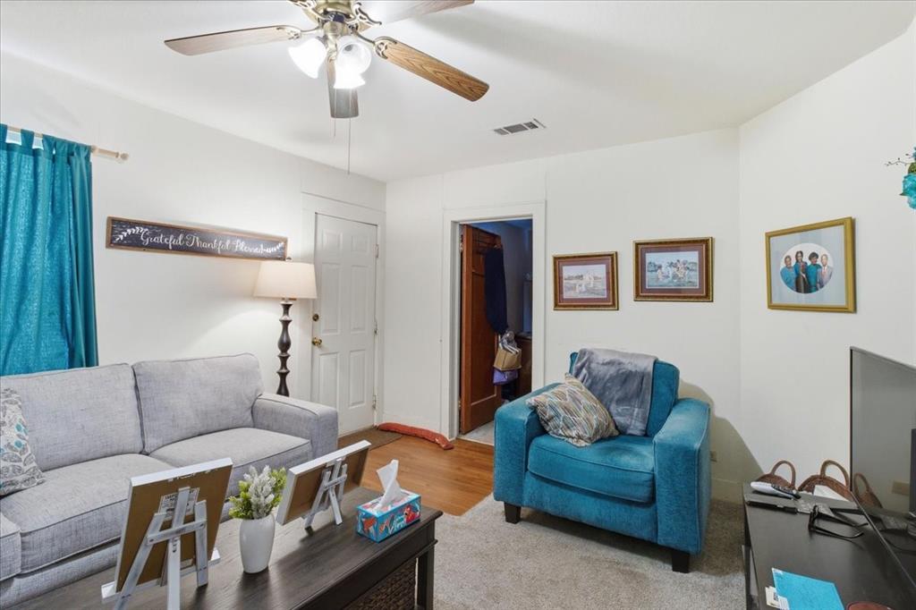 1000 West Morgan Street Denison, TX 75020 - Photo 4 of 30 Living area featuring wood finished floors and ceiling fan
