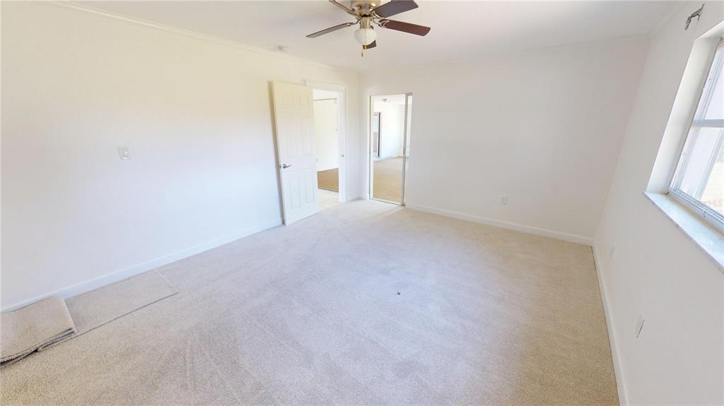 2028 River Basin Terrace Punta Gorda, FL 33982 - Photo 13 of 40 an empty room with a ceiling fan and window