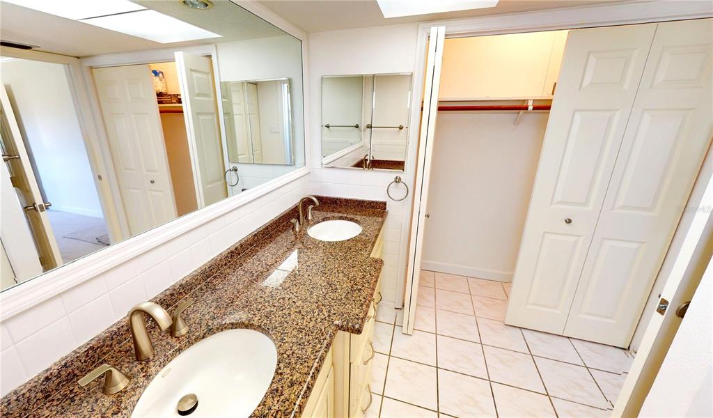 2028 River Basin Terrace Punta Gorda, FL 33982 - Photo 16 of 40 a bathroom with a sink a mirror and a shower