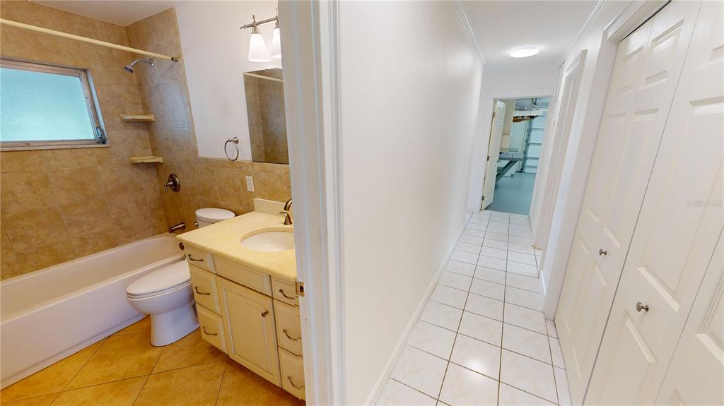 2028 River Basin Terrace Punta Gorda, FL 33982 - Photo 21 of 40 a bathroom with a granite countertop sink a toilet and shower