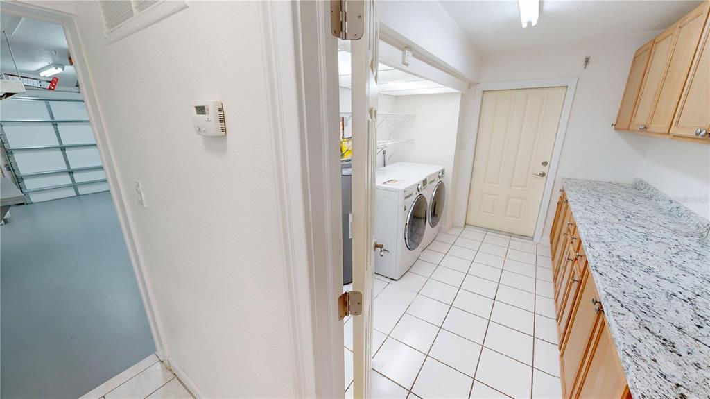 2028 River Basin Terrace Punta Gorda, FL 33982 - Photo 27 of 40 a bathroom with a granite countertop shower and a sink