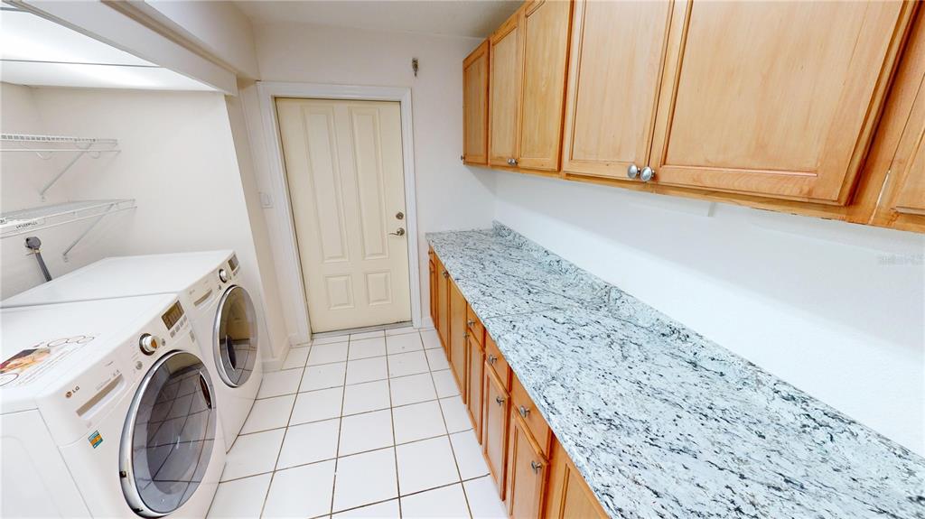 2028 River Basin Terrace Punta Gorda, FL 33982 - Photo 28 of 40 a utility room with dryer and washer
