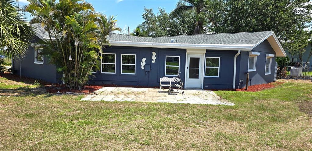2028 River Basin Terrace Punta Gorda, FL 33982 - Photo 32 of 40 a front view of a house with a yard and seating space