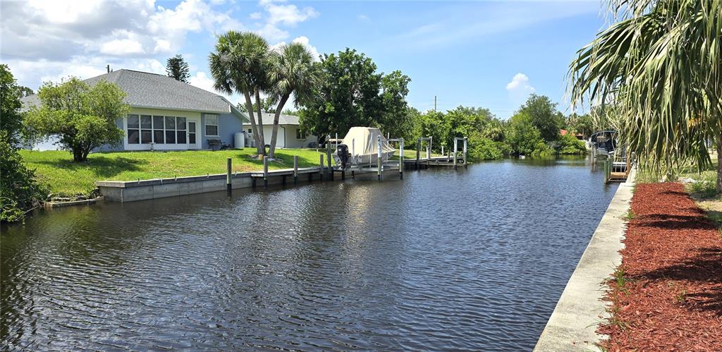 2028 River Basin Terrace Punta Gorda, FL 33982 - Photo 34 of 40 a view of a lake with palm trees