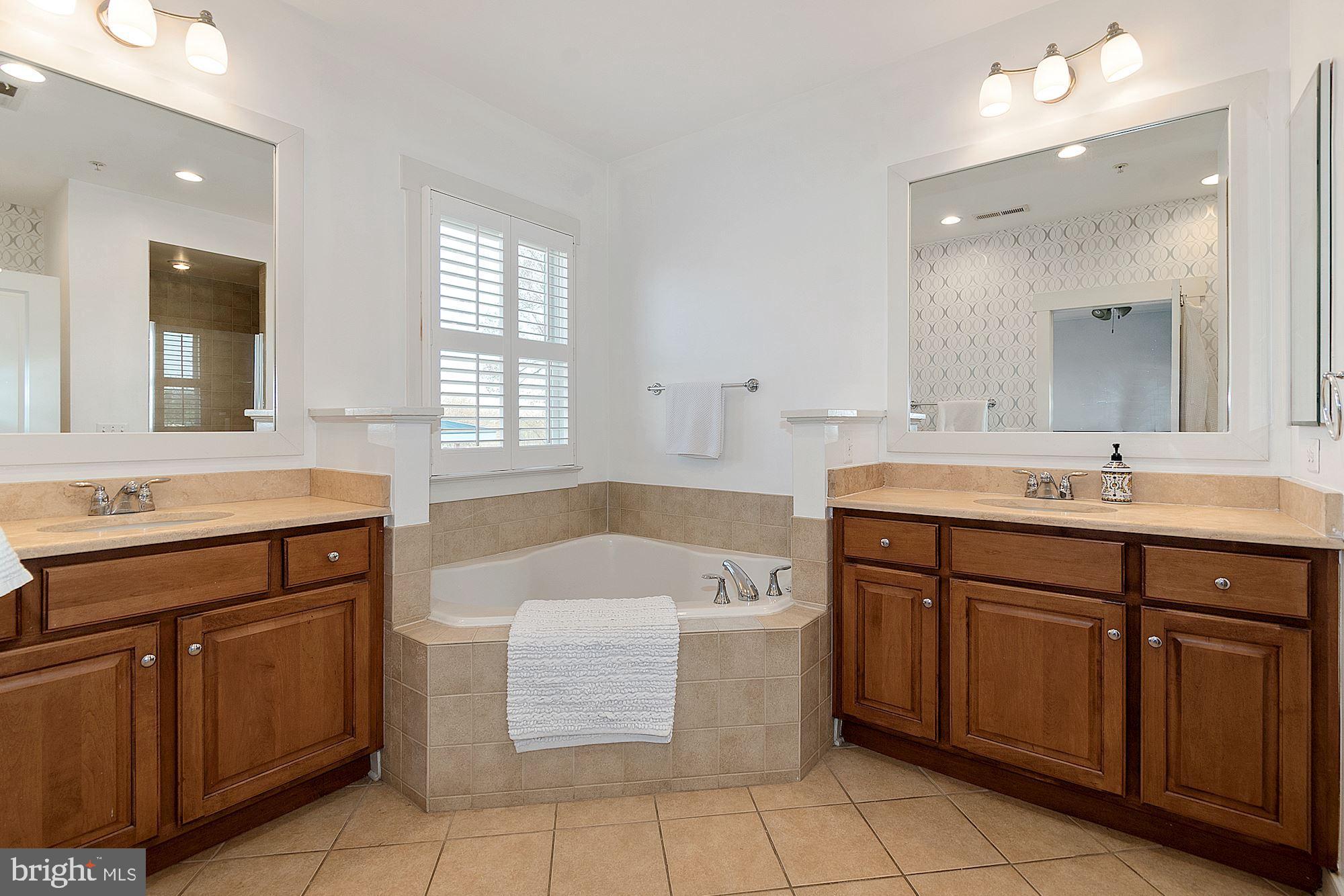 9502 Ament Street Silver Spring, MD 20910 - Photo 27 of 48 His and Her sinks, and a large soaking tub