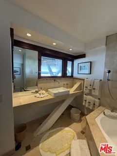 a room with lots of chairs and mirrors