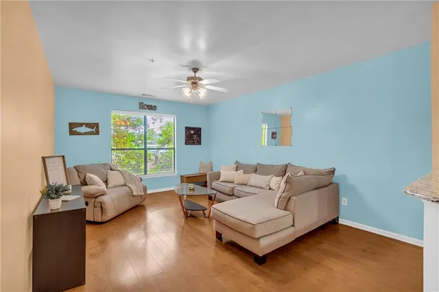 a view of living room with furniture and a window