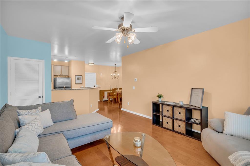 821 Ralph McGill Boulevard Northeast, Unit 2303 Atlanta, GA 30306 - Photo 14 of 43 a living room with furniture and a chandelier