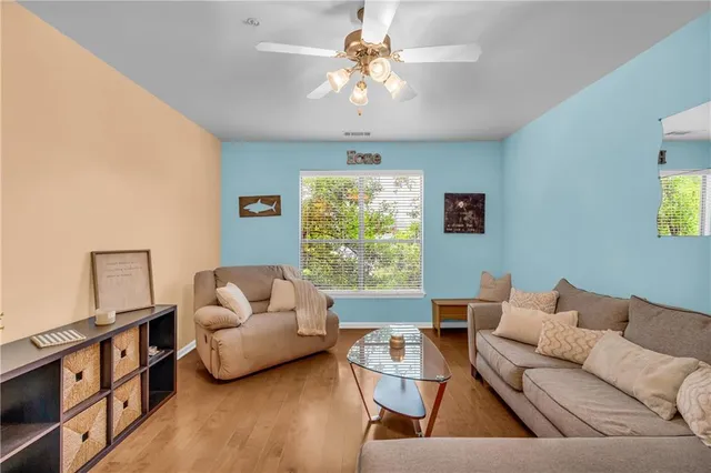 a bathroom with a granite countertop sink mirror vanity and toilet