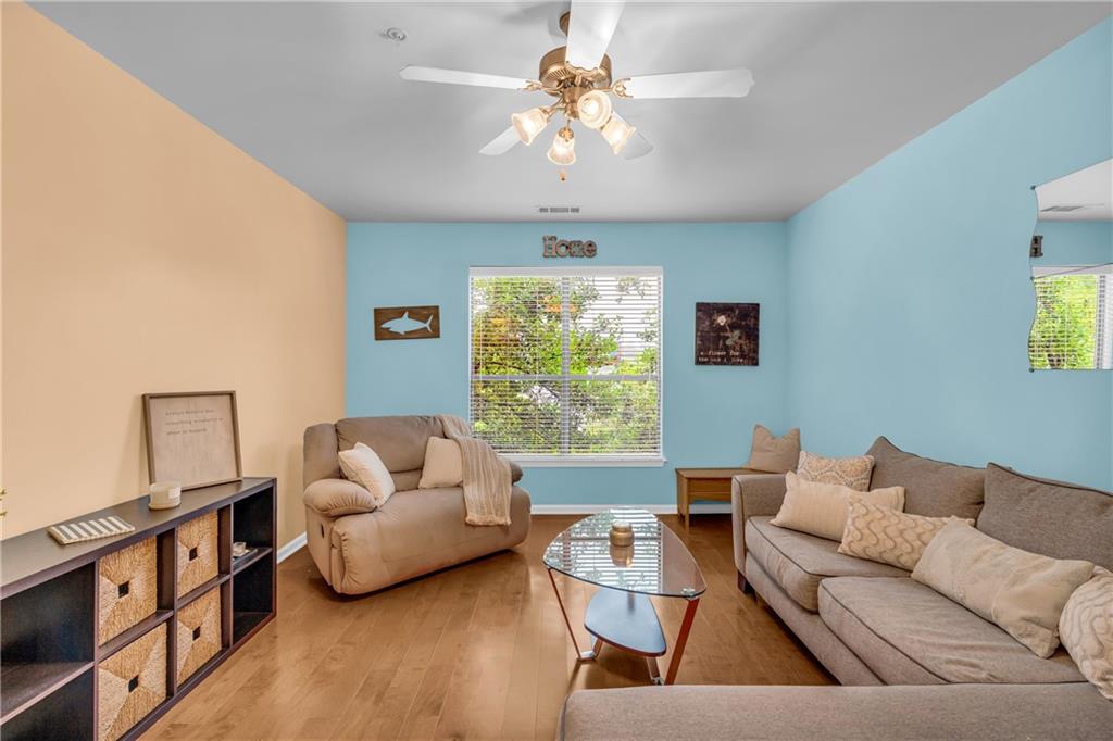 821 Ralph McGill Boulevard Northeast, Unit 2303 Atlanta, GA 30306 - Photo 15 of 43 a living room with furniture and a large window