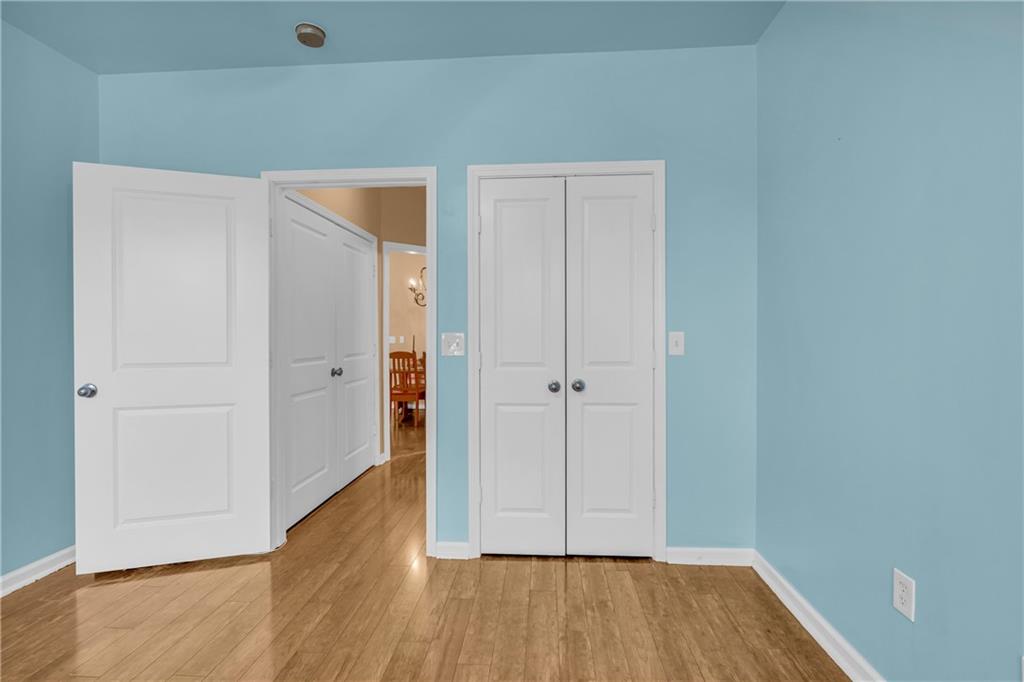 821 Ralph McGill Boulevard Northeast, Unit 2303 Atlanta, GA 30306 - Photo 22 of 43 a view of an empty room with wooden floor