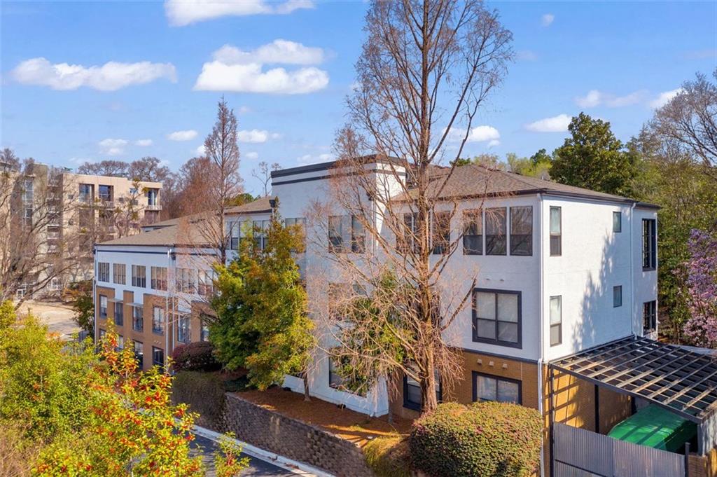 821 Ralph McGill Boulevard Northeast, Unit 2303 Atlanta, GA 30306 - Photo 31 of 43 a view of a blue building with large windows
