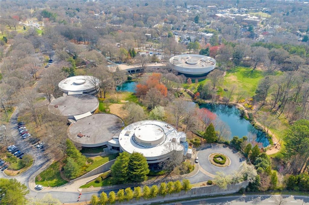821 Ralph McGill Boulevard Northeast, Unit 2303 Atlanta, GA 30306 - Photo 38 of 43 a bathroom with a toilet a sink and a mirror