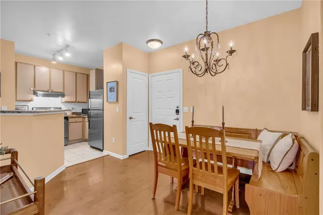 a kitchen with a stove a sink and a refrigerator