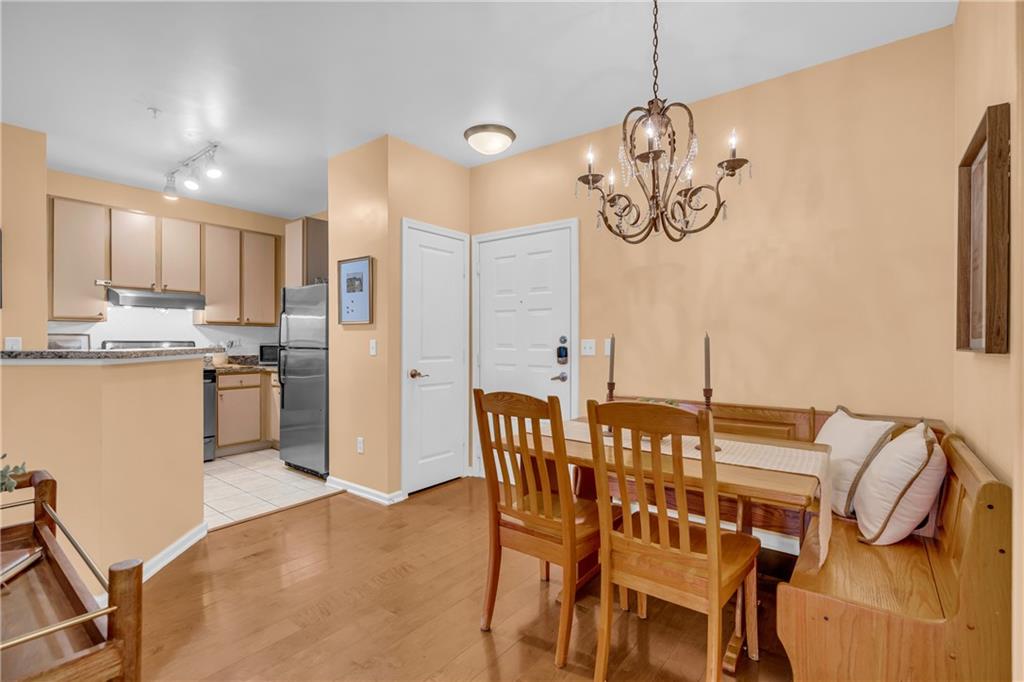 821 Ralph McGill Boulevard Northeast, Unit 2303 Atlanta, GA 30306 - Photo 4 of 43 a view of kitchen and dining room