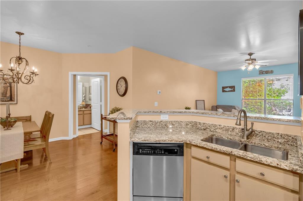 821 Ralph McGill Boulevard Northeast, Unit 2303 Atlanta, GA 30306 - Photo 10 of 43 a kitchen with stainless steel appliances granite countertop a sink and a granite counter tops