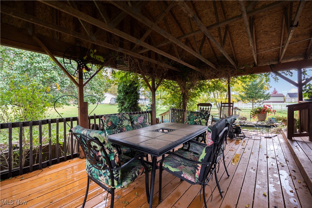 14951 Rickel Road West Salem, OH 44287 - Photo 40 of 46 Wooden terrace with outdoor dining space