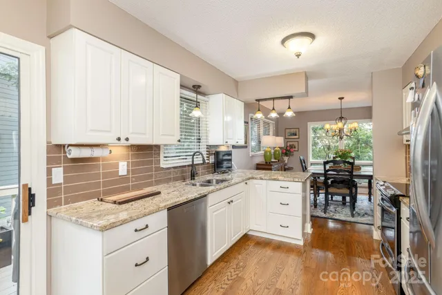 a kitchen with a sink stove and cabinets