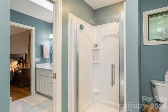 a bathroom with a shower and a sink