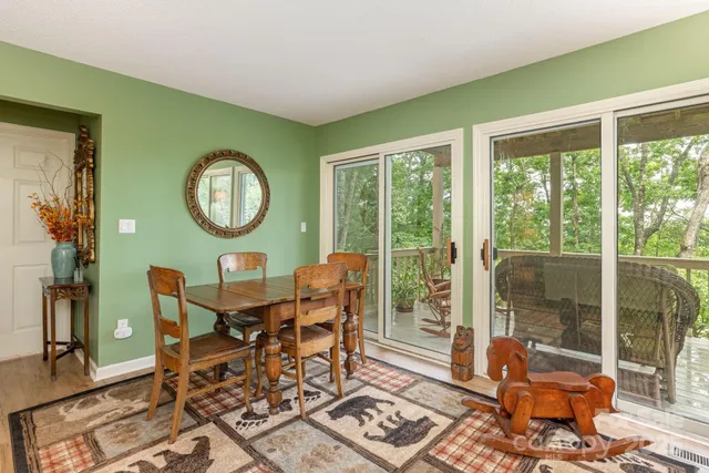 a dining room with furniture and a window