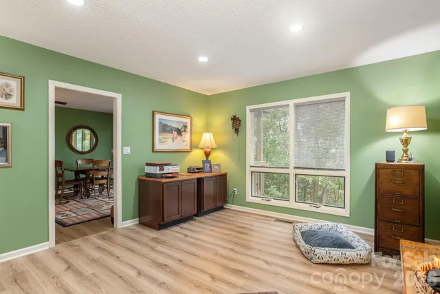 a view of a livingroom with furniture and windows