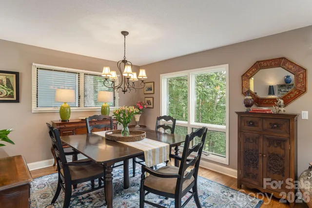a dining room with furniture window and outside view