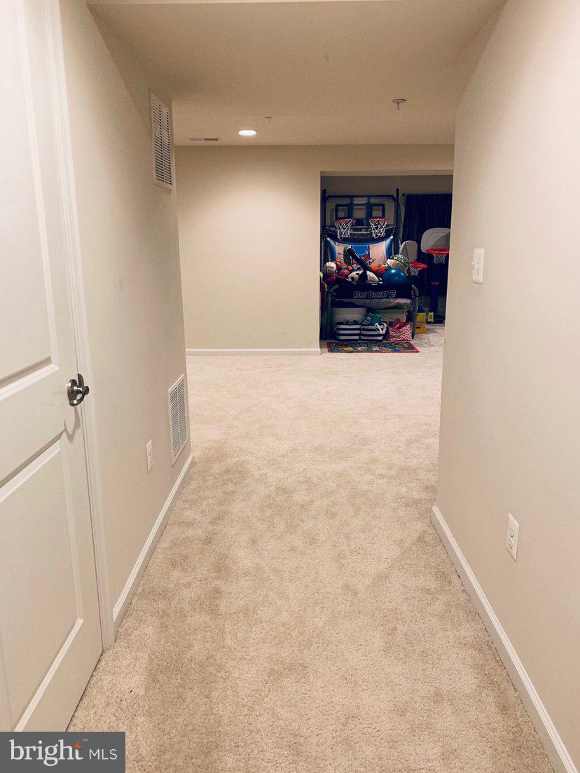 14315 Lusby Ridge Road Accokeek, MD 20607 - Photo 12 of 32 Basement Hallway