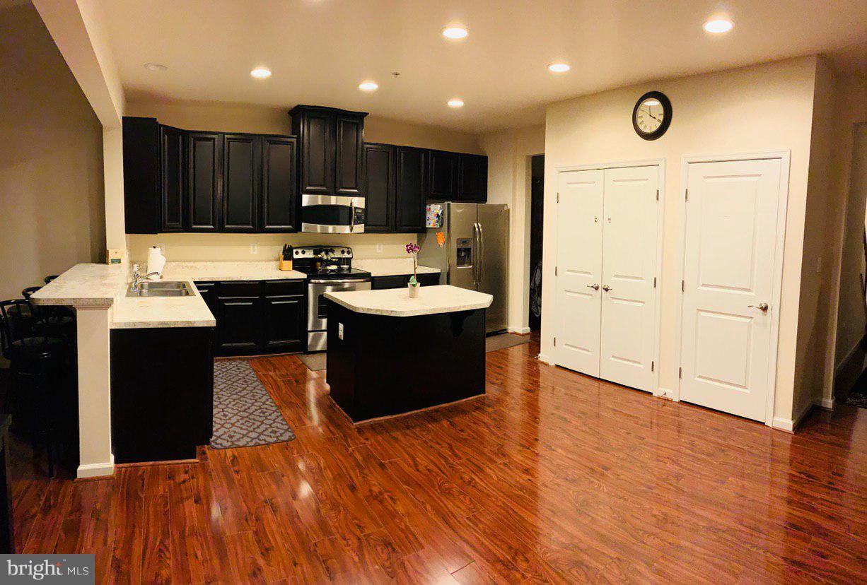 14315 Lusby Ridge Road Accokeek, MD 20607 - Photo 5 of 32 Kitchen with Island & Stainless Steel Appliances