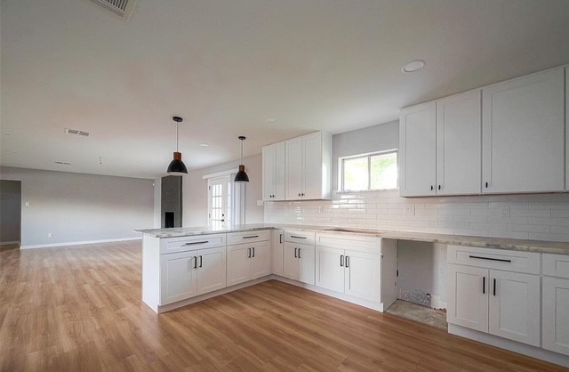 4800 Country Club View Baytown, TX 77521 - Photo 15 of 35 a kitchen with granite countertop white cabinets and white appliances