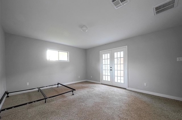 4800 Country Club View Baytown, TX 77521 - Photo 27 of 35 an empty room with windows