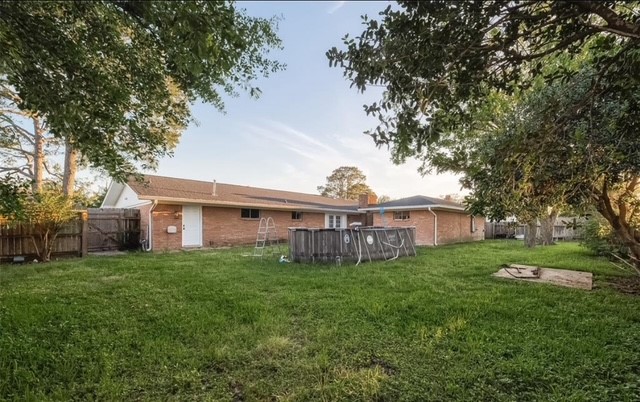 4800 Country Club View Baytown, TX 77521 - Photo 33 of 35 a view of a house with a big yard and large trees