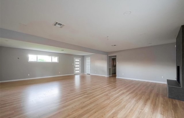 4800 Country Club View Baytown, TX 77521 - Photo 8 of 35 a view of an empty room with wooden floor and a window